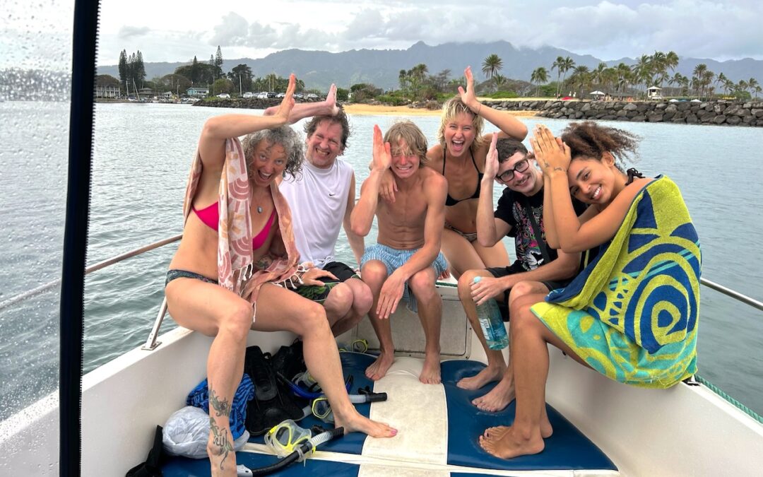 Family and Friends Making Shark Fin Gestures on Boat, Marina Background, Hawaii Ocean Adventure Tours Excursion.
